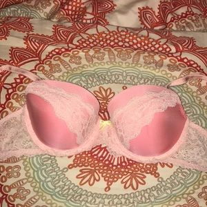 Pink lace bra with a yellow bow